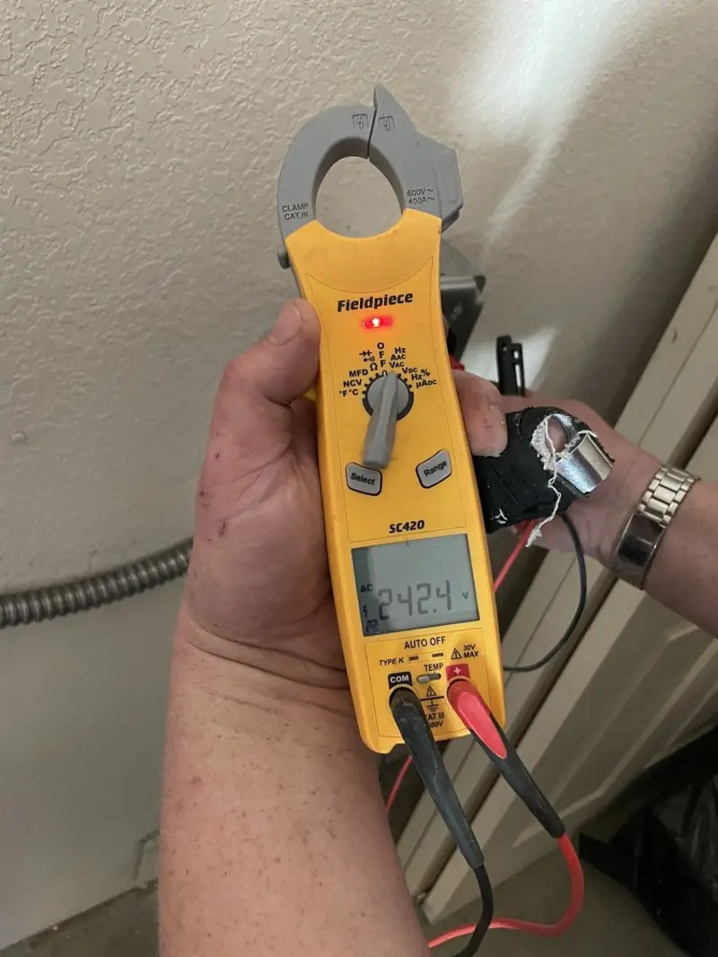 Voltage testing with clamp meter during Ceiling Fan Installation in Richland